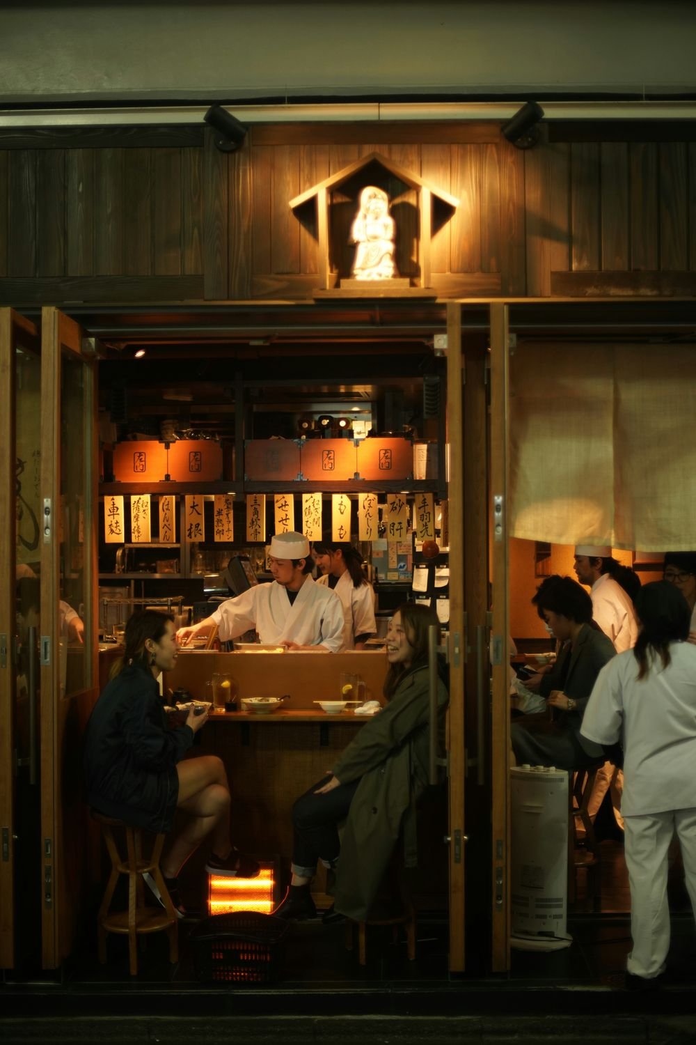 An izakaya counter, mid-evening